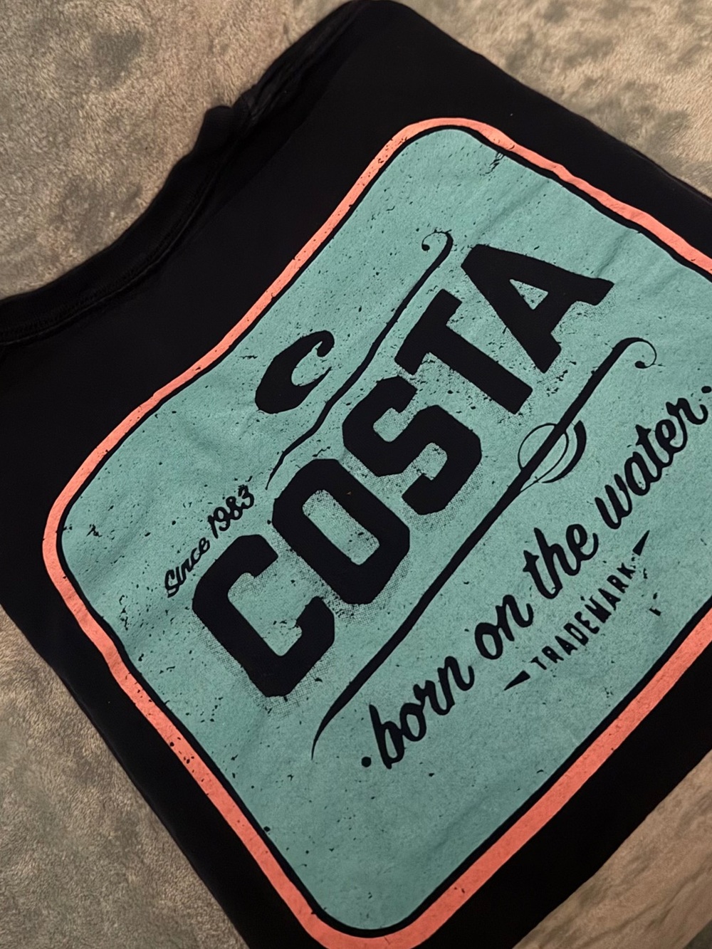 Costa Navy Blue Tee with Teal and Coral Logo. Size Medium